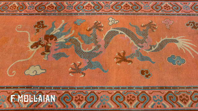 Antique Khotan Rug | contact: info@mollaianrugs.com |


An antique Khotan runner, East Turkestan
Size, approx: 530cm. x 120cm
The soft burned-orange field with two large Imperial Dragons facing each other and chasing framing pearl. In  ...