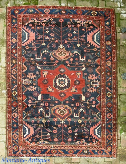 Kurdish. 5 ft x 7 ft 5 inches. Nice larger size. I'm thinking Kolyai or Sanjabi. Single weft on wool foundation. Interesting motifs and myriad abrashes. Overall very good condition. A couple  ...