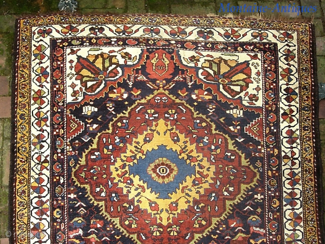 Bahktiari Gallery Runner-- 4 ft 5 in x 14 ft 2 in. Brown wool foundation. slightly flairs at the ends. Aside from this-- a very dynamic old rug in very good condition.  ...