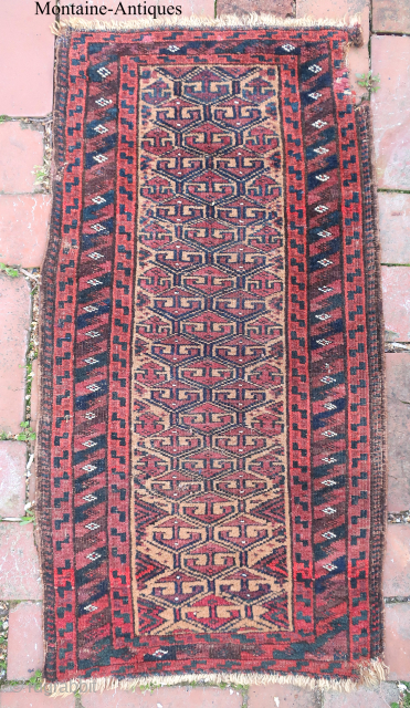 Baluchi Bedding Bag Face 19th cent-- approx 17 1/2 x 34”

Repetitive Turkoman design. Interesting ethnographic piece with Use-wear and damage as shown.           