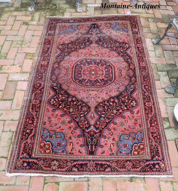 Fereghan Sarouk 19th cent-- 4.5 x 6.10 

Medallion with blue corners. Finely woven opulent old rug. Iron oxidation as shown. ($30 USA shipping)          