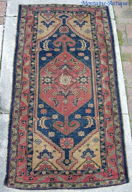 Old Persian. Probably late 19th century. 3 ft 5 inches by 7 ft 0 inches. Beautiful gold corners and stately open-field  Persian medallion. Low, even pile with a smattering of foundation  ...