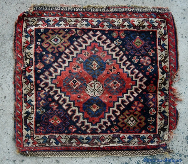 Qashqai 21 inches by 23 inches. Ancient little rug. Rough but still beautiful $12 to ship in usa.               