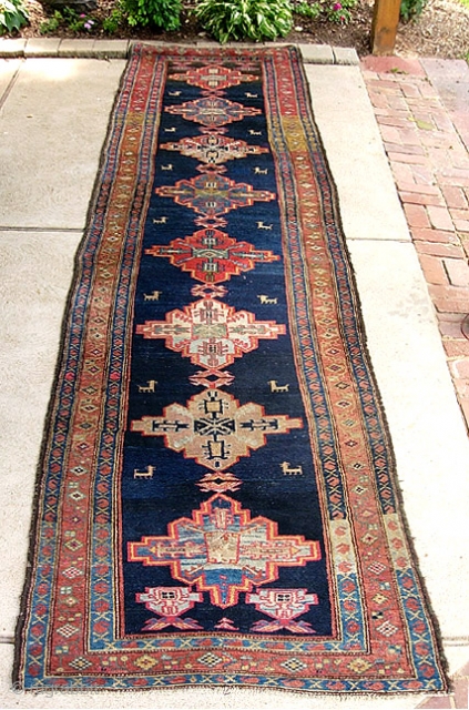 Old Bahktiari Runner-- 3 ft 5 inches by 14 ft. 2 inches. Nice long one. Wonderful thick tribal thing with animals. All natural dyes. Indigo ground but very colorful with lots of  ...