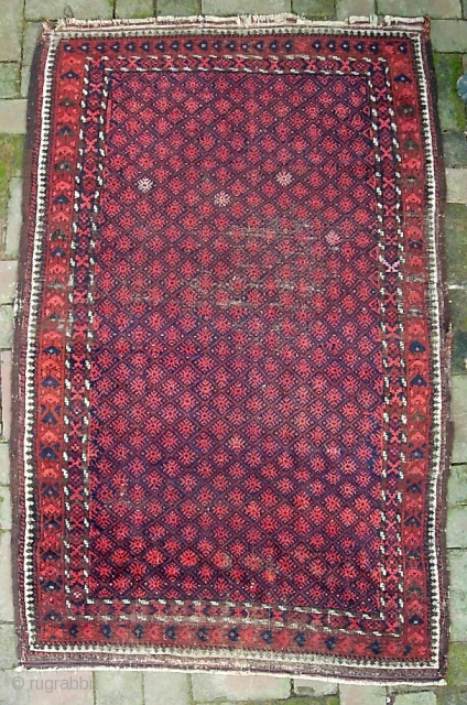 Balouchi-- 3 ft 1 in x 5 ft 3 in. A genuinely old piece, possibly 19th cent. The weave is super fine for a balouch. Condition... not so much. The pictures tell  ...