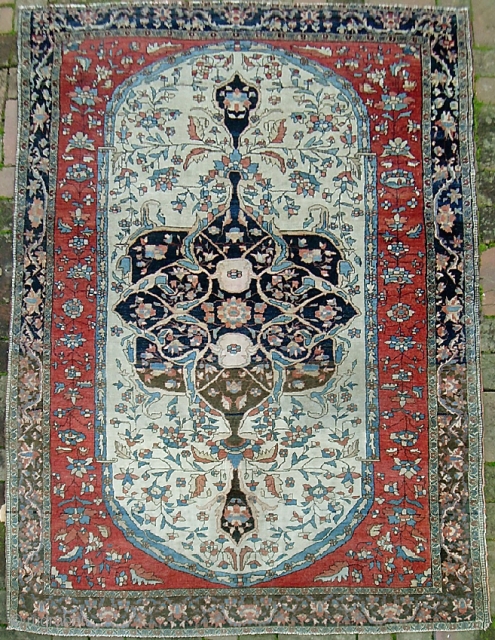 Fereghan Sarouk. 4 ft 4 inches by 6 ft 5 inches.  19th century rug ex. Ben Edwards collection. Hugely decorative old thing w/ big bright ivory medallion. Strong colors w/ numerous  ...