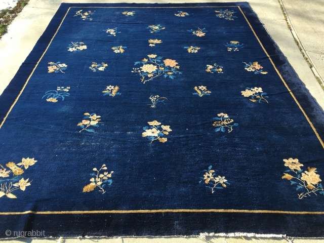 9’1”x 11’5” 1910 Peking Rug with typical white heads poking up and a couple of low areas in pile.              