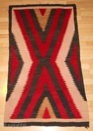 Fresh from an estate and as found: A 1900's to 1920's
3'x5'4" Antique Navajo rug, churro wool, nice tight weave,,
great colors, has a little bleeding (the white area's seem a faint pink....), would  ...