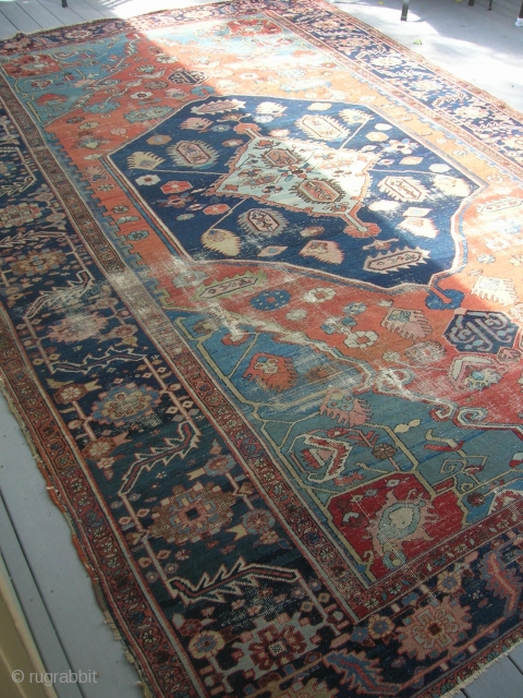 Here we have an old serapi, size 13'9"x9'4" in need of restoration.  It is a pretty carpet in my opinion.            