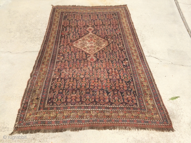 As found: 1900's to 1920's Persian Khamseh in good condition measuring 7'5"x 4'7", three inches difference in width from one end to the other (4'6" to 4'9"), pile is low and even,  ...