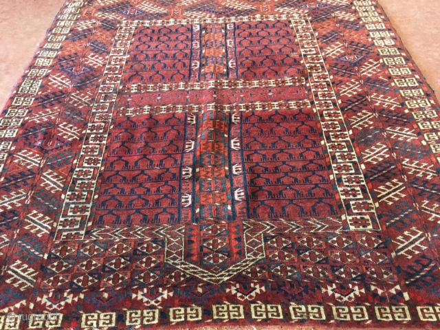 1890’s Tekke with loss at both ends and two small old repairs measuring 4’7”x 3’11”, thick pile, nice colors and design. Thanks           