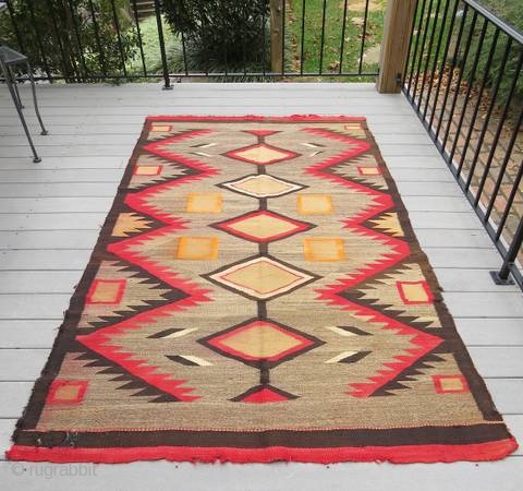 Rug-Pickers find as found: A 1920's to 1930's 5x8.5 Navajo rug with some holes and some fraying on the edges, but overall in good condition.  Thanks for looking.    