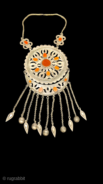 urathan
Antique Turkmen necklace, decorated carnelian stones. 278 Grams. Pendant size 14cm x 17cm without tassels.tassels are 10cm. 

Please contact from murathanantiques@gmail.com            