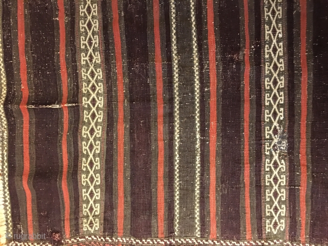 Antique Balouch Kilim with all good colors including generous amounts of aubergine. Old repairs and wear as seen in photos, otherwise in good condition.
Size: 7' X 2'8"/213 X 81cm. Washed. Buyer pays  ...