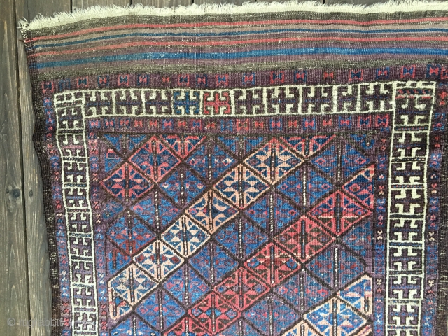 Antique Baluch rug, most likely 4th Qtr 19th century. Unusual diagonal field pattern with all natural colors including an outstanding purple. Size: 4'10"X 3'1". Soft, thin blanket-like handle and glossy wool. Medium  ...