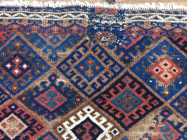 Early Jaf Kurd chuval fragment. Beautiful saturated natural colors that include a good variety of blues and blue-greens. Missing top and bottom borders.  Worn condition and with a patch from another  ...