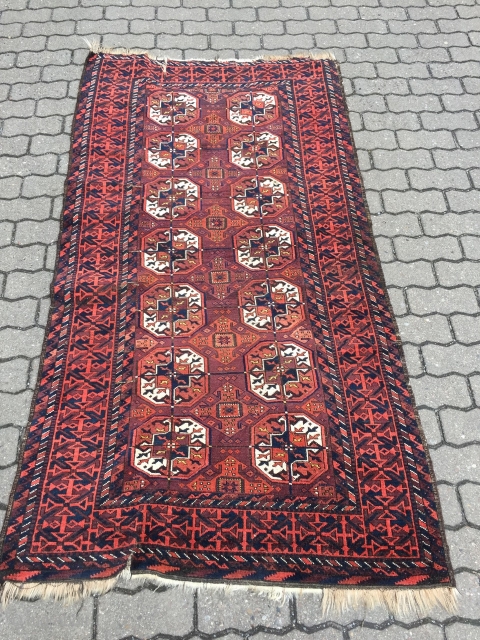 A Baluch interpretation of a Turkmen Tekke pattern: antique Baluch rug, size: ca 197cm x 102cm / 6'5''ft x 3'4''ft             