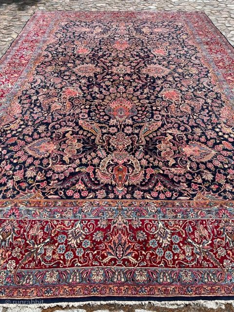 A highly decorative large antique Persian Kirman carpet, size: circa 520x345cm / 17’1ft by 11’3ft beautiful color combination, navy blue field color and a very well executed floral design. http://www.najib.de
   