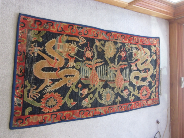 Tibetan: Khaden, Double dragon/ phoenix motif, ti9ghtly woven but with visible condition issues on the edges and plle. c.1900              