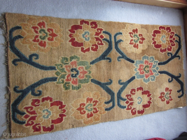 Tibetan khaden, abt 3 by 6 ft, c.1925, with spacious flower and vine design on tan ground                