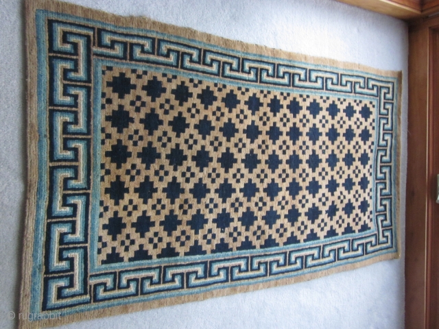 Tibetan:Khaden with geometric central design and attractive blue key border, about 3 by 6 ft, c.1930                 