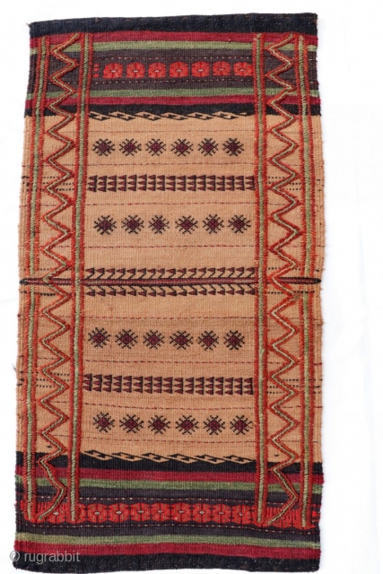 A kilim woven in the Sistan region by Serkhat Beluch weavers. For the lenghtwise borders a different technique has been chosen adding volume to the kilim. All natural dyes. 79x42cms. 1900s. (K1710061).  ...