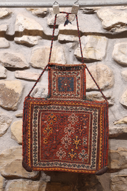 A superb antique Arab namakdan or salt bag woven with the soumak technique from Iran. All the dyes are natural, with a particularly beautiful indigo blue. The lower corners are probably worn,  ...