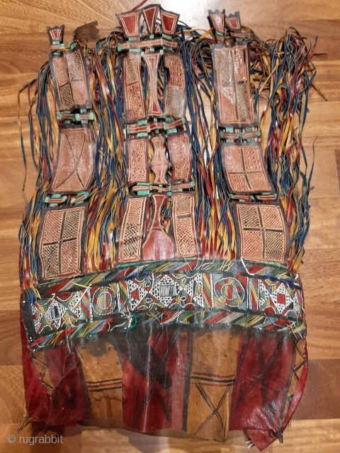 Tuareg leather womans travel bag ("aghrig"), with hand worked and dyed leather, probably goat skin. Intricate leather work with check pattern cut into dyed skin. The green dyed leather colour is considered  ...