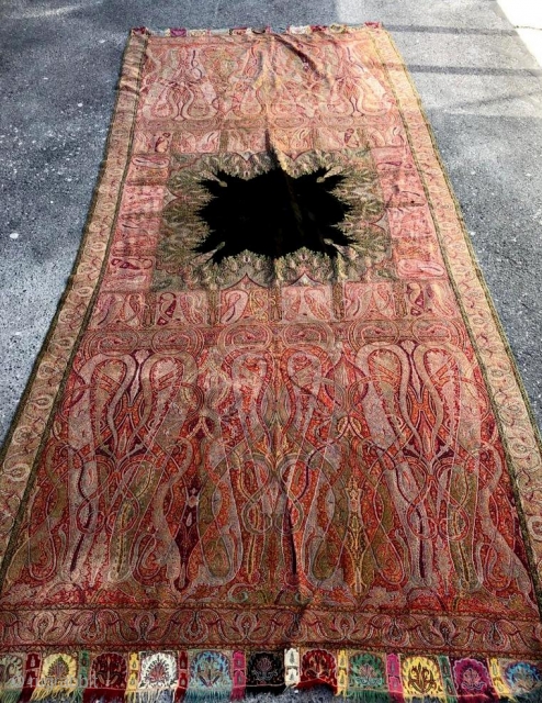 
a very beautiful old Kashmir long shawl with a Black center which is not very easy to find,with a few small holes which is very normal in these type of vintage shawls.Colour  ...