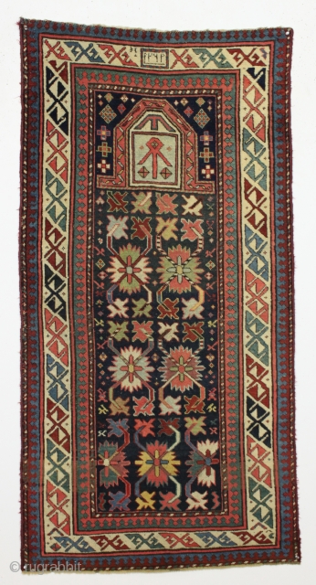 19th century Caucasian Chan-Karabagh prayer rug.  Look in your Kaffel book for its fraternal but undated twin.               