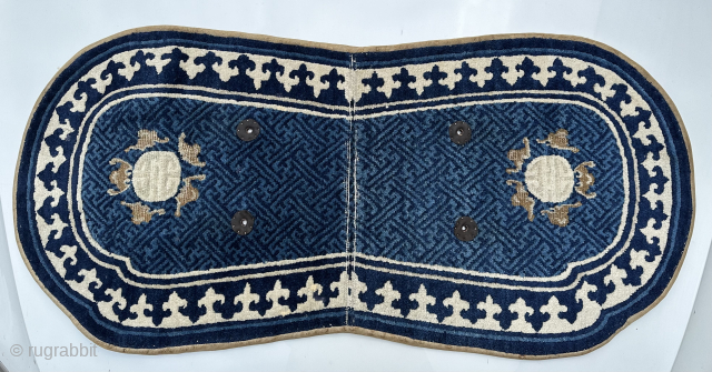 Antique Chinese saddle rug with a graphic trefoil border. Email -owenrugs@gmail.com                      