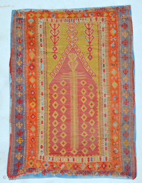 Turkish Prayer Kilim,  all colors are very attractive [but synthetic] instead of blue on the border. just washed it then put a protection backside.
no restoration or repile done in this kilim,  ...