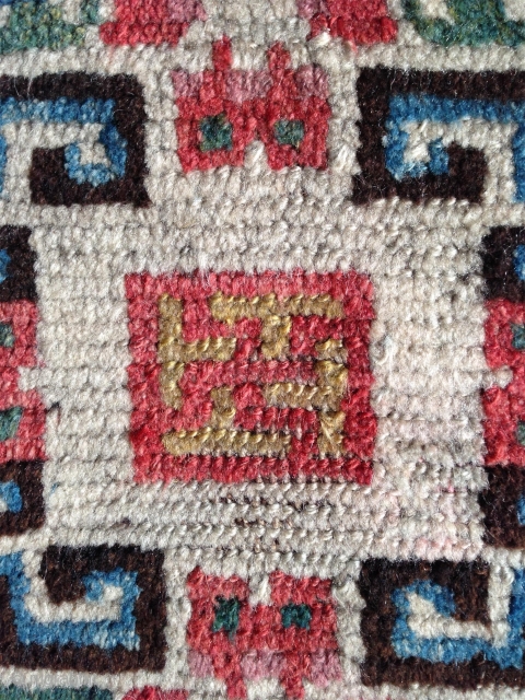 beautiful mid 19th century tibetan square. wonderful natural colors including  strong yellow and greens.a  very happy piece with a not so common white ground..and very good condition    