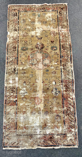 Rare, small  18th c. Yellow gold Khotan rug. 2'-8" x 5'-11". Damaged with old faded repair but still beautiful. Has a "gravitas" that only the best have. Look at the border.  ...