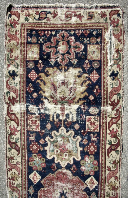 Classical 18th c. Northwest Persian long rug (detail) with Harshang design and dragon border.                   