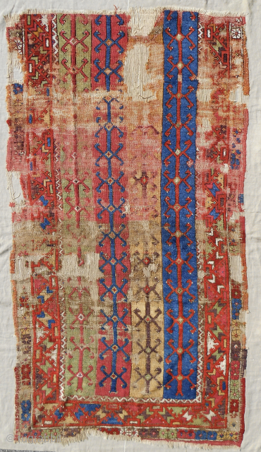 18th c. Anatolian Konya rug fragment. Rare striped design. Conserved and professionally mounted on linen. Decent pile with best old color. Please email: patrickpouler@gmail.com         