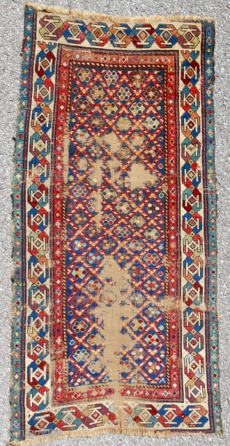 Small(32" x 64") Caucasian striped lattice rug with exceptional range of old color. Low, thin and worn but silky pile. Age: 1840-60.           