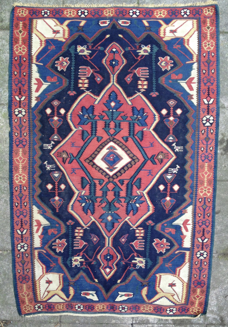 Old Bijar/Senneh kelim. Beautiful saturated colors, in good condition considering its age.

166cm x 111cm                   