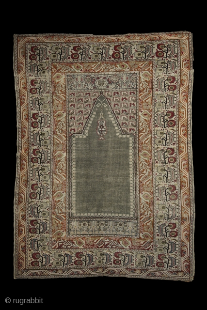 How to draw tension...  trembling borders with running flames and an empty green mihrab..... Ghiordes prayer rug, 172x125 cm, wool on cotton, ca 1900. More pieces: http://rugrabbit.com/profile/5160     