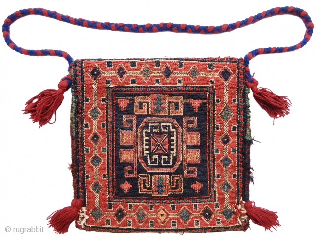 small Shahsevan sumak bag, probably a chanteh with added tassels and strap. size is 1'x1'. inv# 17691. Collection of Dr. and Mrs. William T. Price. 
       