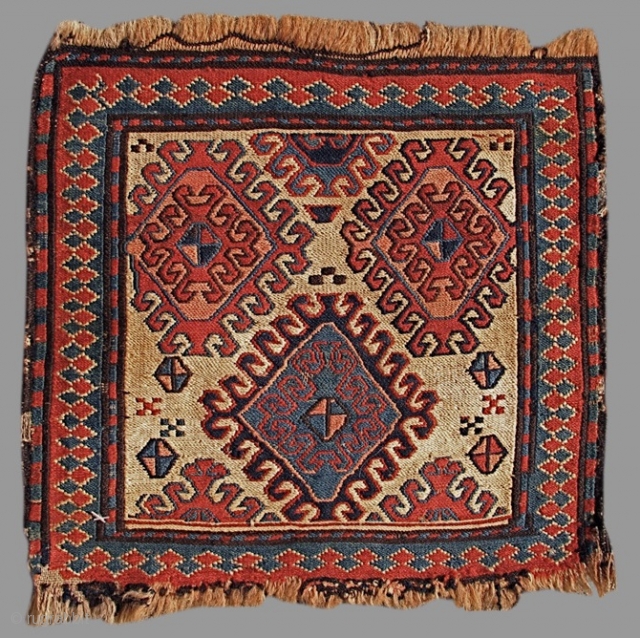 Shasevan Soumac Bagface with a colorful large-scale latch-hook design drawn against a small white ground canvas. 

size is 1'2"x1'2"

Inv#     15170
         