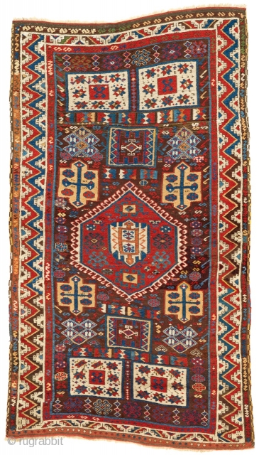 East Anatolian brown-ground "2 1 2" format rug with a split Memling border and an extensive range of brightly colored dynamically drawn elements articulated within the field. This piece measures 4'3" x  ...