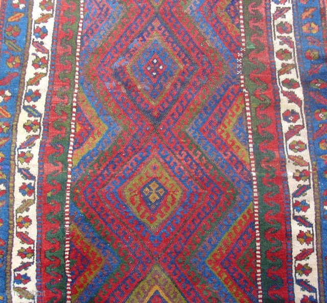 Jaf Kurd long rug with fiery red diamond field and bold minor borders. Size = 3'8" x 10'4" . Inv. # 14832.           