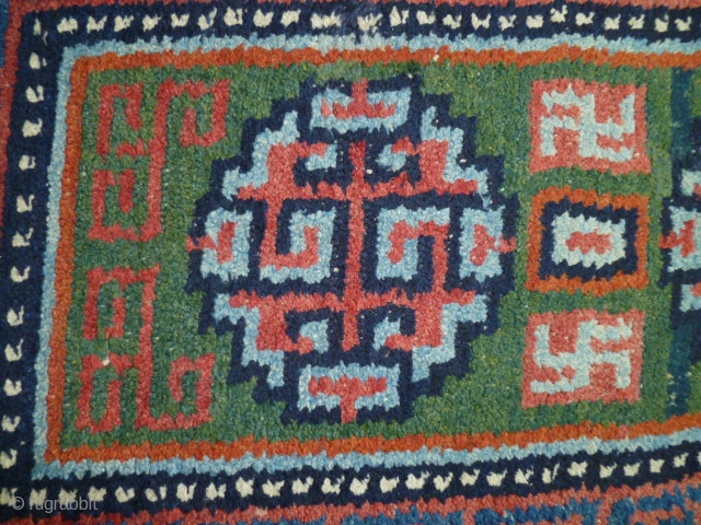A "Wangdan", 19th century Tibet little rug.  Size is 27 X 42 inches. Perfect condition and unusual weave - see shot or reverse.         