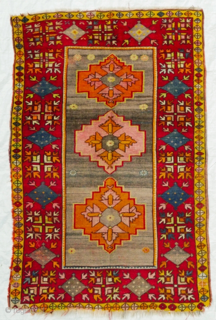 This is an authentic early 1900s all-wool Konya rug in Kazak design in brilliant colours defying age and use
Origin: Turkey, Konya
Measurements: c. 160x100 cm or c. 5.2 by 3.3 feet

Material:	Wool on wool
Manufacturing  ...