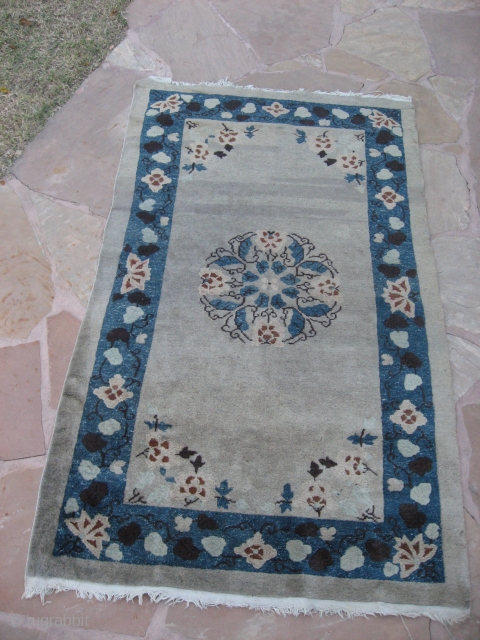 Chinese Rug  6'9" x4".  Slightly tip faded reddish tan color.  Grey field.  Circa 1900?
Good condition.              