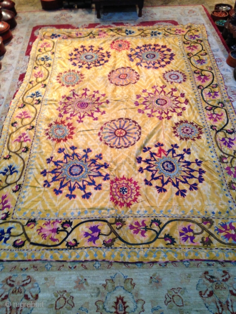 Nice old Ubzbek suzani, embroidery on yellow ikat very rare piece, some color run in some area and few small holes, size is arround 250/150.        