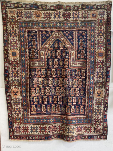 Marasali Prayer rug, 19th c., 3’7” x 4’7”; excellent array of naturally dyed colors on a deep blue/black field. areas of wear, and 1 small area of re-knotting. Diagonally aligned rows of  ...