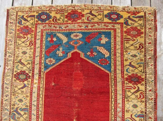 Ladik Prayer Rug, 1st Qtr. 19th C.3'5" x 5'4"An early Ladik prayer rug., circa 1800, with an unusual treatment of the mihrab. The customary stepped sides of the arch have been simplified  ...