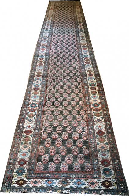 Antique 18' long Persian Heriz runner with unusual paisley pattern. It is 3' in width.                  